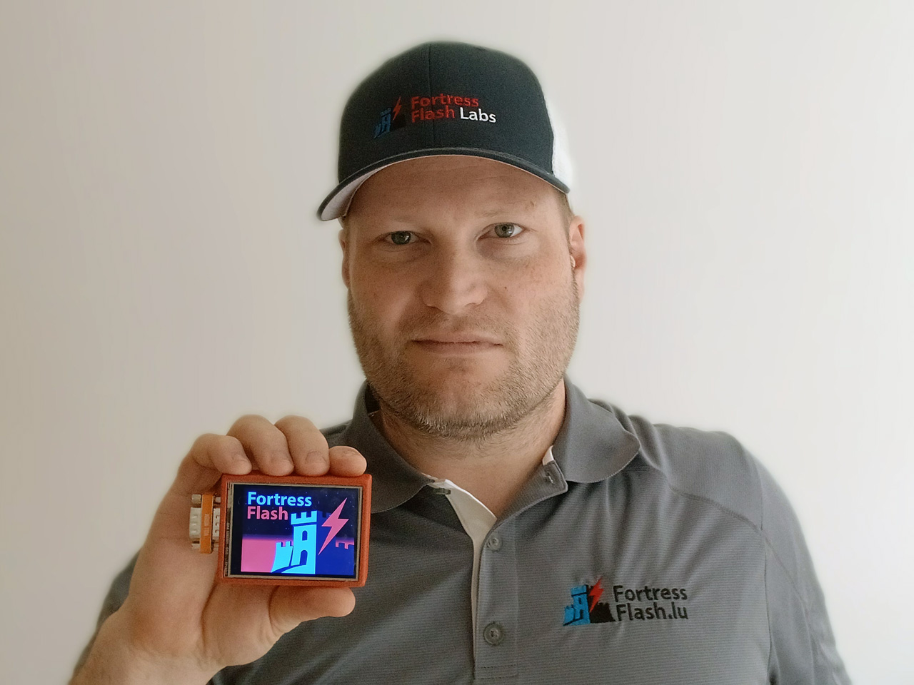 Founder holding the FortressFlash device